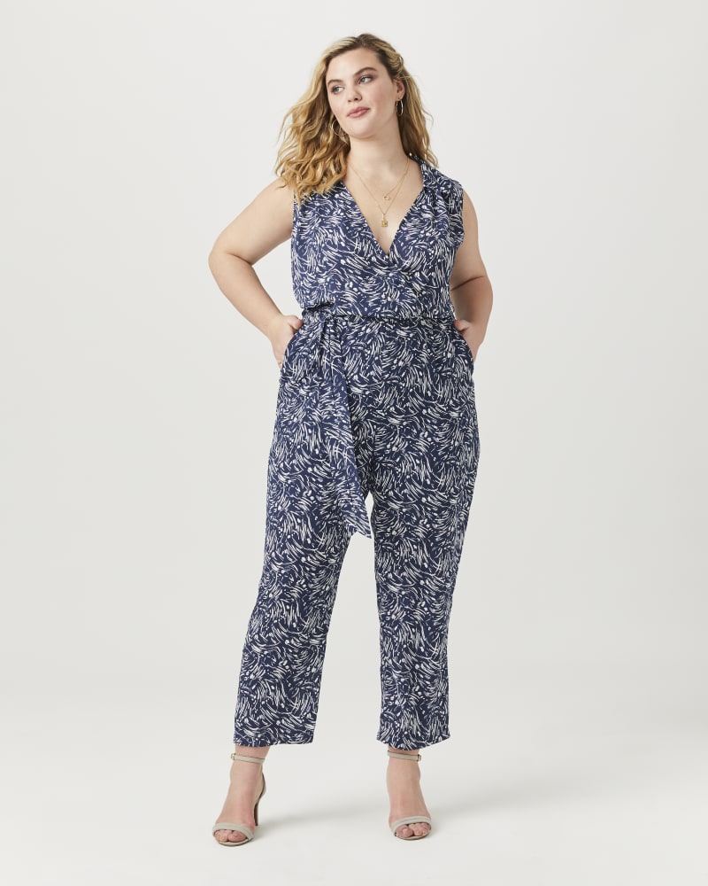 Plus size model with hourglass body shape wearing Geraldine Surplice Jumpsuit by Ryan Wylde | Dia&Co | dia_product_style_image_id:152697